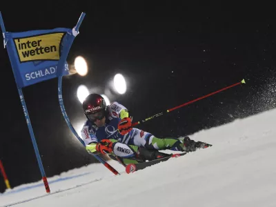 Slovenia's Zan Kranjec speeds down the course during a men's World Cup giant slalom, in Schladming, Austria, Tuesday, Jan. 28, 2025. (AP Photo/Marco Trovati)
