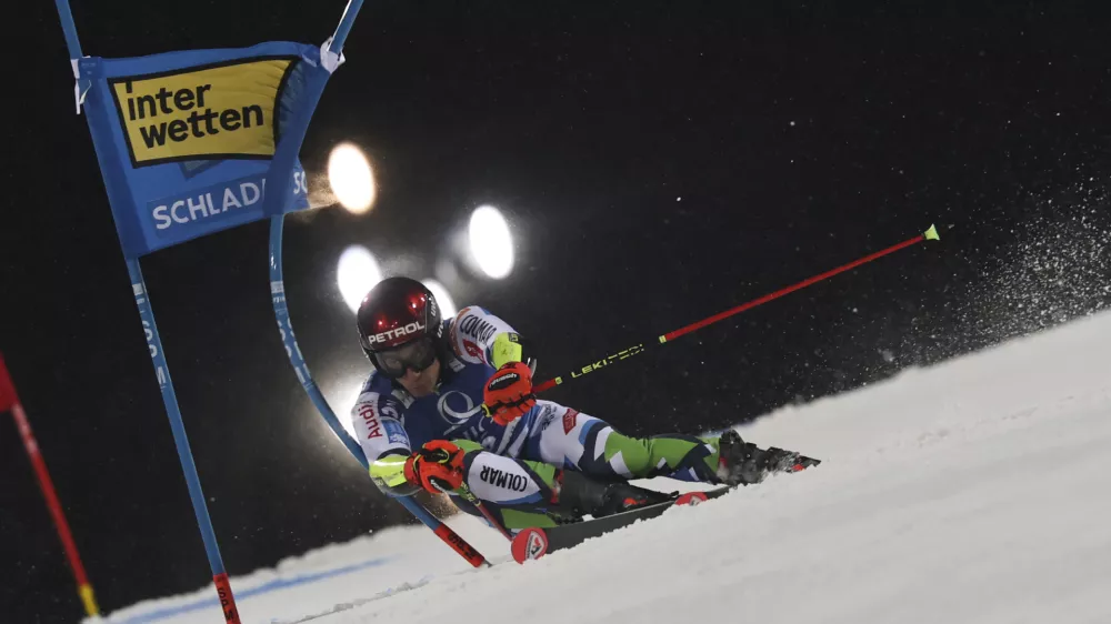 Slovenia's Zan Kranjec speeds down the course during a men's World Cup giant slalom, in Schladming, Austria, Tuesday, Jan. 28, 2025. (AP Photo/Marco Trovati)