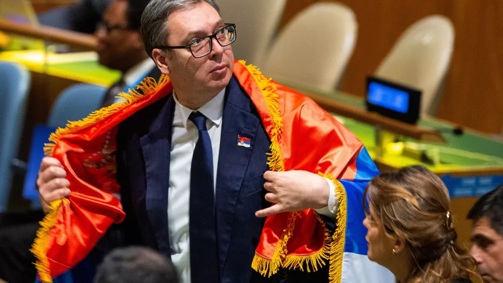 Serbian President Aleksandar Vucic wears Serbia's flag after voting in the United Nations General Assembly on the creation of an international day to commemorate the Srebrenica genocide, at the UN Headquarters in New York City, U.S. May 23, 2024. REUTERS/Eduardo Munoz