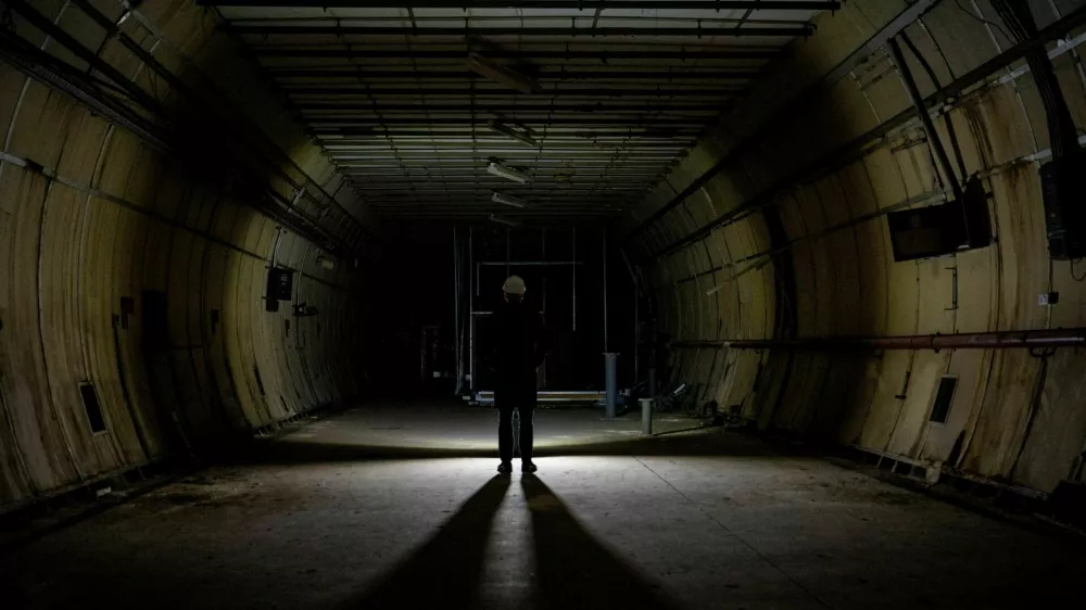 A journalist stands, as members of the press are shown around underground tunnels used during World War Two as shelters during the Blitz that are now due to be developed into a new tourist attraction called The London Tunnels, in London, Britain, January 29, 2025. REUTERS/Chris J. Ratcliffe  TPX IMAGES OF THE DAY