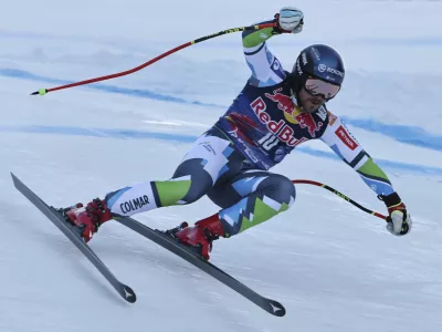 Slovenia's Miha Hrobat speeds down the course during an alpine ski, men's World Cup downhill, in Kitzbühel, Austria, Saturday, Jan. 25, 2025. (AP Photo/Marco Trovati)