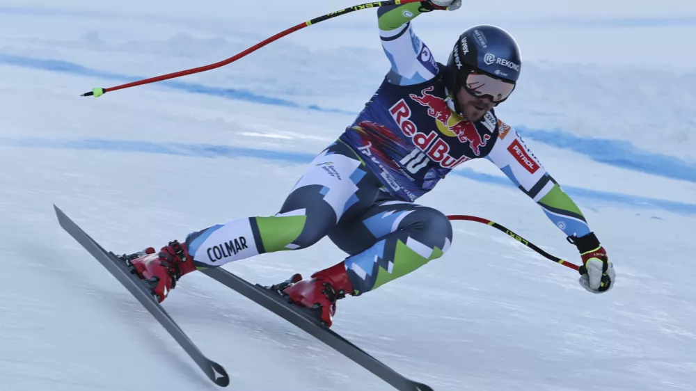 Slovenia's Miha Hrobat speeds down the course during an alpine ski, men's World Cup downhill, in Kitzbühel, Austria, Saturday, Jan. 25, 2025. (AP Photo/Marco Trovati)