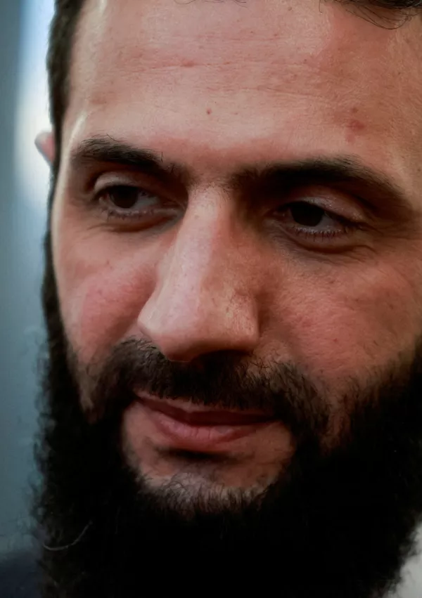 FILE PHOTO: Syria's de facto leader Ahmed al-Sharaa, also known as Abu Mohammed al-Golani, speaks to the media on the day he meets with Qatar's Minister of State Mohammed bin Abdulaziz Al-Khulaifi, after the ousting of Syria's Bashar al-Assad, in Damascus, Syria, December 23, 2024. REUTERS/Ammar Awad//File Photo