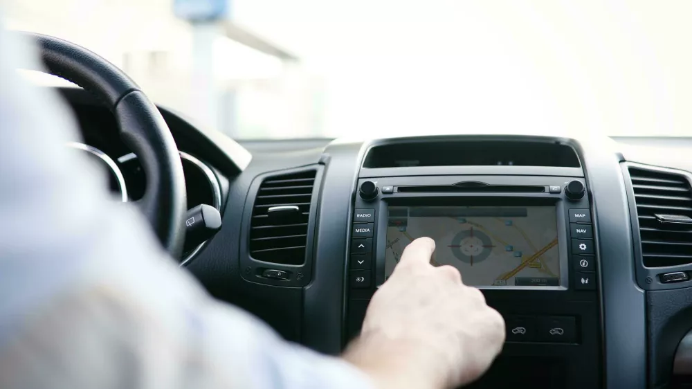 KME2MR Man using navigation system while driving car