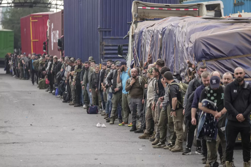 Captured Romanian mercenaries, who were fighting alongside Democratic Republic of Congo army (FRDC), wait to be released by M23 rebels at Gisenyi border point in Congo, Wednesday, Jan. 29, 2025, after the M23 rebels advanced into eastern Congo's capital Goma. (AP Photo/Brian Inganga)