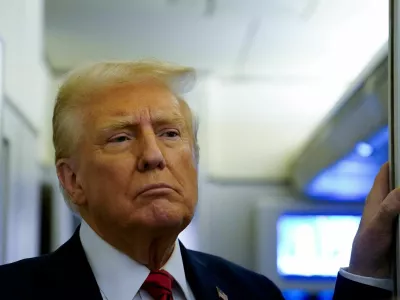 FILE PHOTO: U.S. President Donald Trump speaks to reporters aboard Air Force One before arriving at Joint Base Andrews, Maryland, U.S., January 27, 2025. REUTERS/Elizabeth Frantz/File Photo