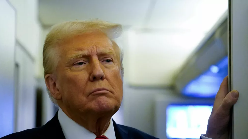 FILE PHOTO: U.S. President Donald Trump speaks to reporters aboard Air Force One before arriving at Joint Base Andrews, Maryland, U.S., January 27, 2025. REUTERS/Elizabeth Frantz/File Photo