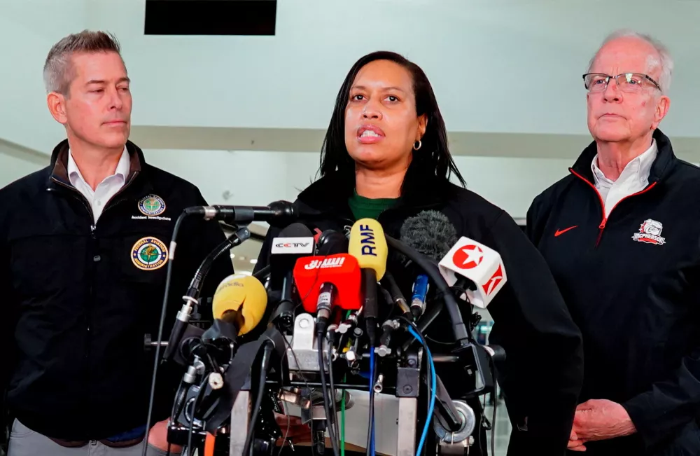 Washington DC Mayor Muriel Bowser addresses the media as Secretary of U.S. Department of Transportation Sean Duffy looks on, after American Eagle flight 5342 collided with a Black Hawk helicopter while approaching Ronald Reagan Washington National Airport and crashed into Potomac River, U.S. January 30, 2025. REUTERS/Ken Cedeno