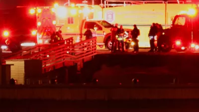 Emergency personnel work near the site of the crash after American Eagle flight 5342 collided with a Black Hawk helicopter while approaching Reagan Washington National Airport and crashed into the Potomac River, outside Washington, U.S., January 30, 2025. REUTERS/Carlos Barria