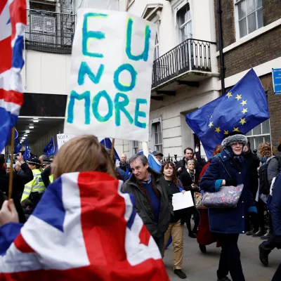 ﻿Pro-Brexit supporters celebrate Britain leaving the EU on Brexit day as anti-Brexit demonstrators are seen walking in the opposite way in London, Britain January 31, 2020. REUTERS/Henry Nicholls - RC23RE91JZAV