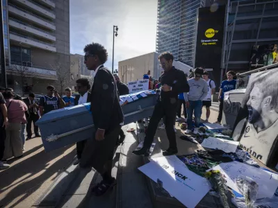 Feb 2, 2025; Dallas, Texas, USA; Dallas Mavericks fans walk to the arena with a coffin during a mock funeral before the game between the Dallas Stars and the Columbus Blue Jackets at American Airlines Center to protest the trade of Mavericks point guard Luka Doncic to the Los Angeles Lakers. Mandatory Credit: Jerome Miron-Imagn Images