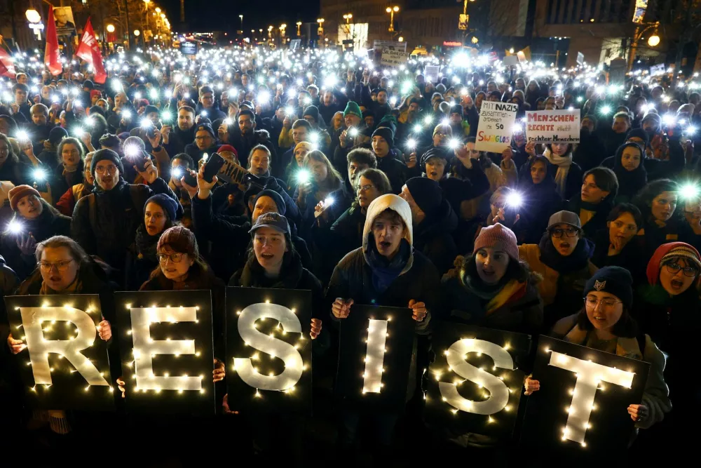 People protest in front of the Christian Democratic Union (CDU) party headquarters after election frontrunner Friedrich Merz succeeded in getting a motion passed in parliament that calls for a migration crackdown including the rejection of asylum seekers at the country's land borders in Berlin, Germany, January 30, 2025. REUTERS/Christian Mang