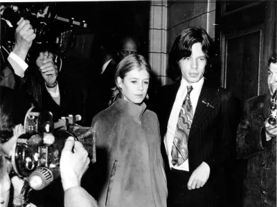 FILE - Mick Jagger, lead singer of The Rolling Stones, and singer Marianne Faithfull appear at Marlborough St. Court for possession of marijuana, in London, England, June 23, 1969. (AP Photo/Eddie Worth, File)