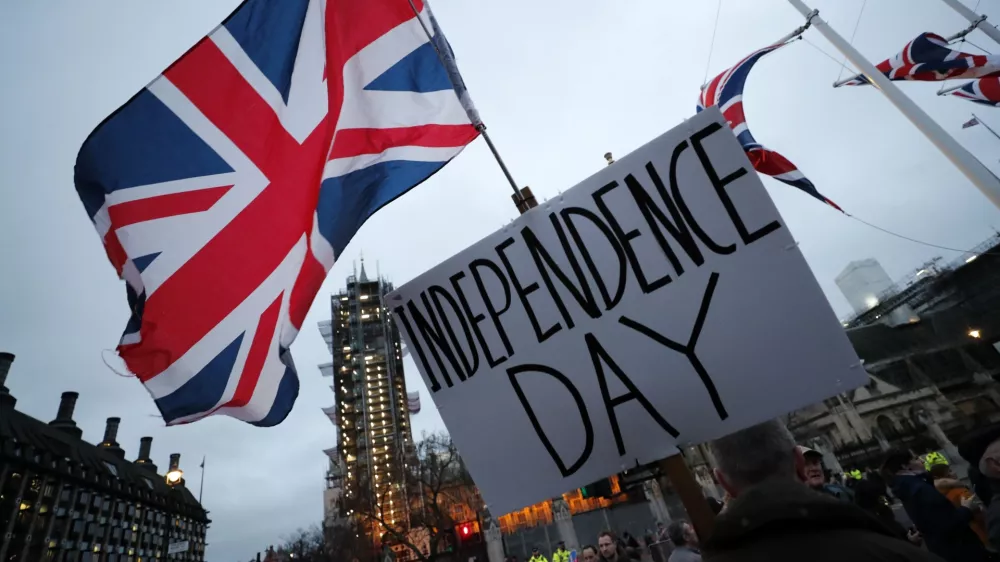 FILE - Brexit supporters gather during a rally in London, Friday, Jan. 31, 2020. Britain officially leaves the European Union on Friday after a debilitating political period that has bitterly divided the nation since the 2016 Brexit referendum. (AP Photo/Frank Augstein, File)