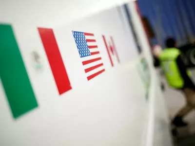 FILE PHOTO: Flags of Mexico, United States and Canada are pictured at a security booth at Zaragoza-Ysleta border crossing bridge, in Ciudad Juarez, Mexico January 16, 2020. REUTERS/Jose Luis Gonzalez/File Photo