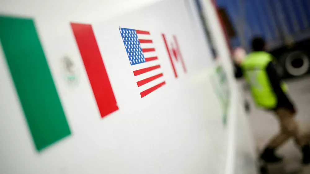 FILE PHOTO: Flags of Mexico, United States and Canada are pictured at a security booth at Zaragoza-Ysleta border crossing bridge, in Ciudad Juarez, Mexico January 16, 2020. REUTERS/Jose Luis Gonzalez/File Photo