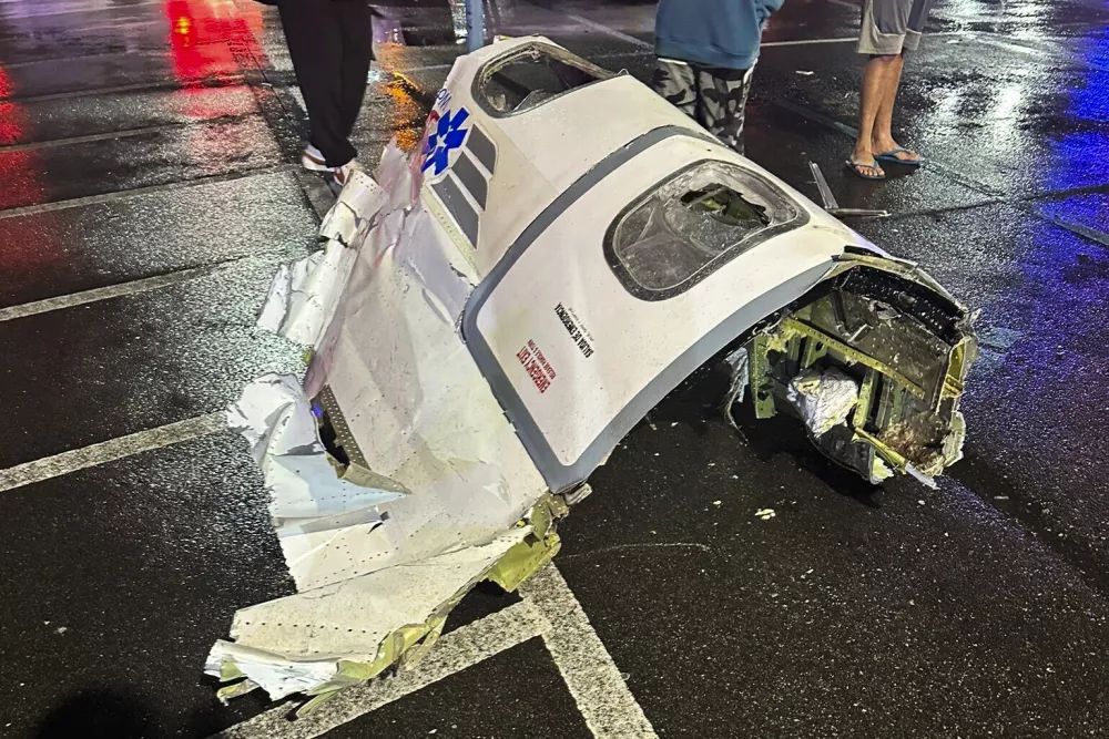 This photo provided by @Kikatechusa shows debris from a plane after crashing in Philadelphia, Friday, Jan. 31, 2025. (@Kikatechusa via AP)