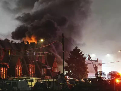 Smoke rises as first responders work the scene after a small plane crashed in Philadelphia, Friday, Jan. 31, 2025. (AP Photo/Matt Rourke)