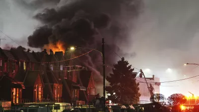 Smoke rises as first responders work the scene after a small plane crashed in Philadelphia, Friday, Jan. 31, 2025. (AP Photo/Matt Rourke)