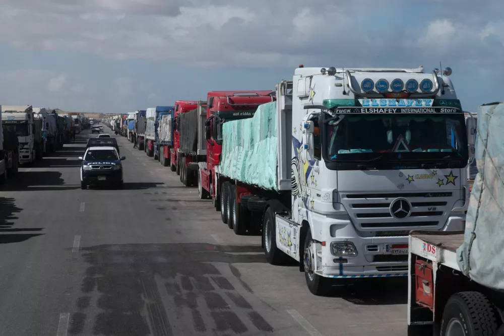 Trucks carrying aid line up near the Rafah border crossing between Egypt and the Gaza Strip, amid a ceasefire between Israel and Hamas, in Rafah, Egypt, February 1, 2025. REUTERS/Mohamed Abd El Ghany