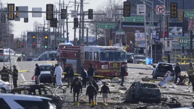 Investigators work the scene where a small plane crashed in Philadelphia, Saturday, Feb. 1, 2025. (AP Photo/Matt Rourke)