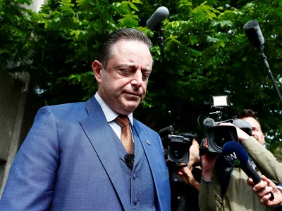 FILE PHOTO: Bart De Wever, President of Flemish nationalist party N-VA, talks to the media after casting his vote for the Belgian general and regional elections and for the European Parliament Elections in Antwerp, Belgium May 26, 2019. REUTERS/Francois Lenoir/File Photo