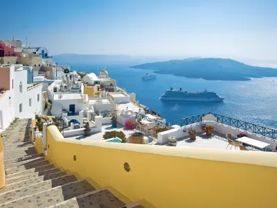 ﻿Fira panorama with caldera view and Nea Kameni, Santorini, Greece