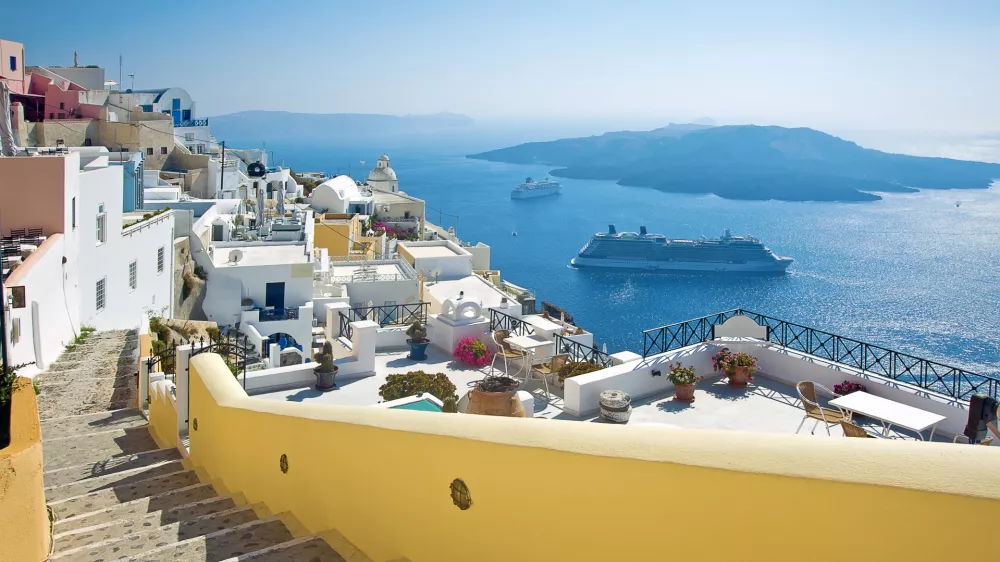 ﻿Fira panorama with caldera view and Nea Kameni, Santorini, Greece