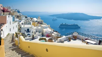 ﻿Fira panorama with caldera view and Nea Kameni, Santorini, Greece