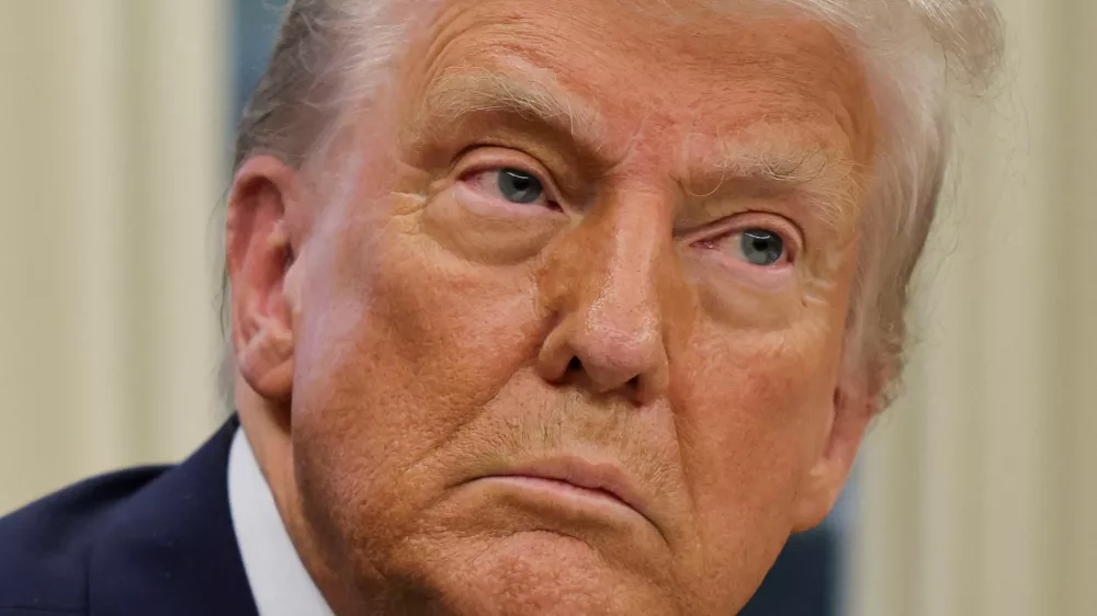 FILE PHOTO: U.S. President Donald Trump looks on, on the day he signs an executive order in the Oval Office at the White House in Washington, U.S., January 31, 2025. REUTERS/Carlos Barria/File Photo