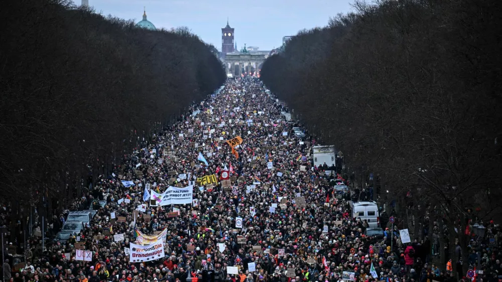 People march during a protest against the migration plans of the CDU party leader and top candidate for chancellor, Friedrich Merz and the far-right Alternative for Germany party (AfD), in Berlin, Germany February 2, 2025. REUTERS/Annegret Hilse