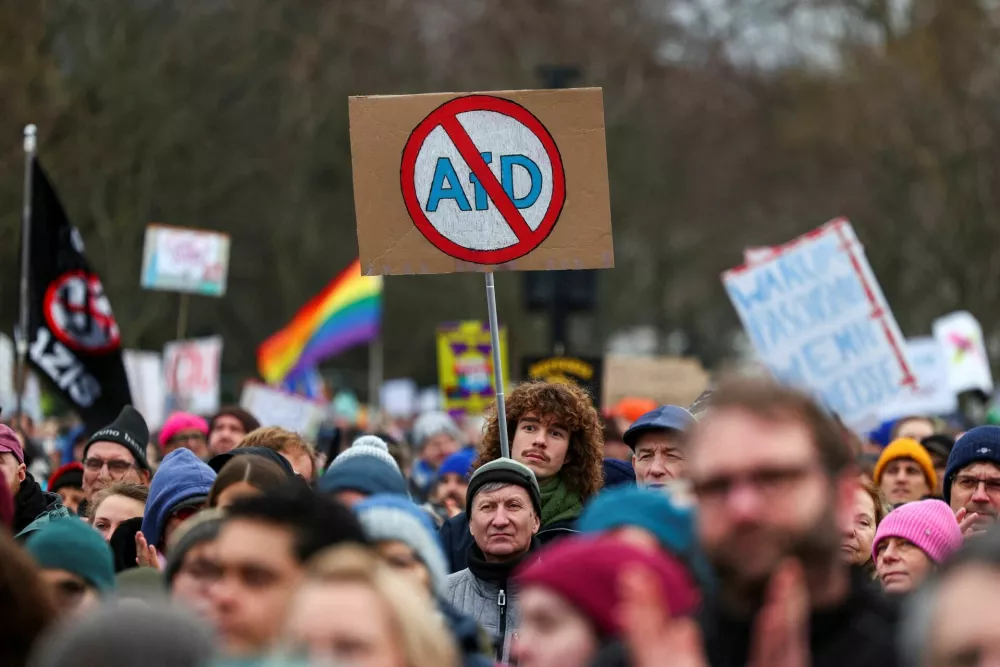 People attend a protest against the migration plans of the CDU party leader and top candidate for chancellor, Friedrich Merz and the far-right Alternative for Germany party (AfD) in Berlin, Germany February 2, 2025. REUTERS/Christian Mang