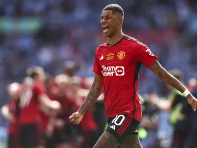 FILE - Manchester United's Marcus Rashford celebrates after his team won the English FA Cup final soccer match between Manchester City and Manchester United at Wembley Stadium in London, on May 25, 2024. (AP Photo/Ian Walton, File)