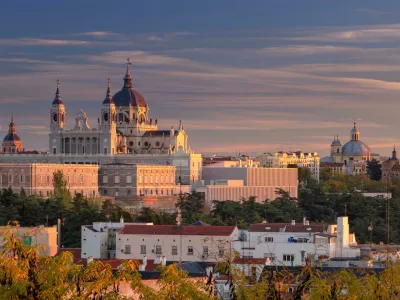 HANEYB Madrid. Panoramic image of Madrid skyline with Santa Maria la Real de La Almudena Cathedral and the Royal Palace during sunset.