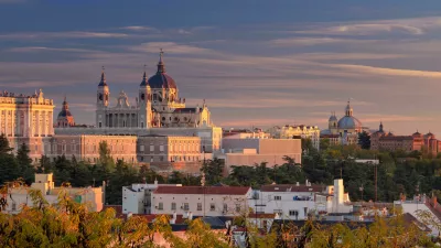 HANEYB Madrid. Panoramic image of Madrid skyline with Santa Maria la Real de La Almudena Cathedral and the Royal Palace during sunset.