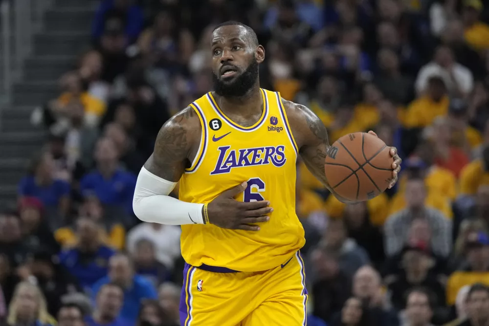 Los Angeles Lakers forward LeBron James dribbles down the court during the first half of an NBA basketball Western Conference semifinal game against the Golden State Warriors, Tuesday, May 2, 2023, in San Francisco. (AP Photo/Jeff Chiu)