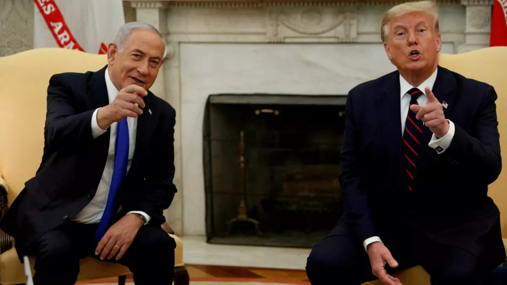 FILE PHOTO: Israel's Prime Minister Benjamin Netanyahu meets with U.S. President Donald Trump prior to signing the Abraham Accords, normalizing relations between Israel and some of its Middle East neighbors in a strategic realignment of Middle Eastern countries against Iran, during a meeting in the Oval Office at the White House in Washington, U.S., September 15, 2020. REUTERS/Tom Brenner/File Photo