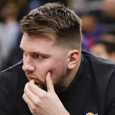 Los Angeles Lakers guard Luka Doncic sits on the bench before an NBA basketball game against the Los Angeles Clippers, Tuesday, Feb. 4, 2025, in Inglewood, Calif. (AP Photo/Kevork Djansezian)