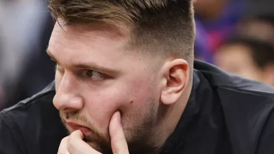 Los Angeles Lakers guard Luka Doncic sits on the bench before an NBA basketball game against the Los Angeles Clippers, Tuesday, Feb. 4, 2025, in Inglewood, Calif. (AP Photo/Kevork Djansezian)