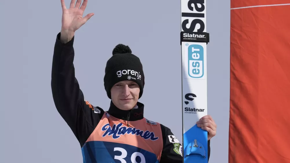 Lovro Kos of, Slovenia, celebrates his victory in the Men's Large Hill HS128 individual World Cup ski jumping competition, Saturday, Feb. 10, 2024, in Lake Placid, N.Y. (AP Photo/Robert F. Bukaty)