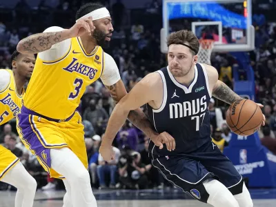 FILE - Dallas Mavericks guard Luka Doncic drives against Los Angeles Lakers forward Anthony Davis (3) during the first half of an NBA basketball game in Dallas, Tuesday, Dec. 12, 2023. (AP Photo/LM Otero, File)