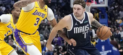 FILE - Dallas Mavericks guard Luka Doncic drives against Los Angeles Lakers forward Anthony Davis (3) during the first half of an NBA basketball game in Dallas, Tuesday, Dec. 12, 2023. (AP Photo/LM Otero, File)