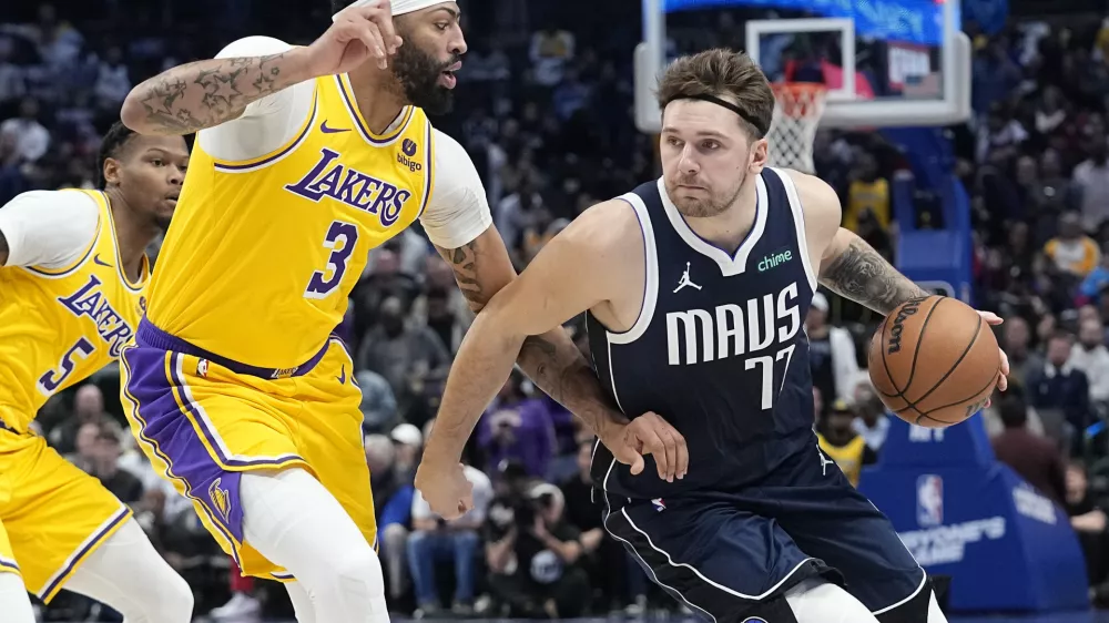 FILE - Dallas Mavericks guard Luka Doncic drives against Los Angeles Lakers forward Anthony Davis (3) during the first half of an NBA basketball game in Dallas, Tuesday, Dec. 12, 2023. (AP Photo/LM Otero, File)