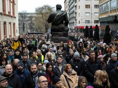 University of Belgrade faculty members and students observe fifteen minutes of silence to pay their respects to the victims of the November 2024 Novi Sad railway station roof collapse, outside the Faculty of Philosophy, in Belgrade, Serbia, February 3, 2025. REUTERS/Marko Djurica