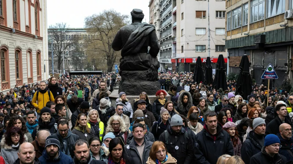 University of Belgrade faculty members and students observe fifteen minutes of silence to pay their respects to the victims of the November 2024 Novi Sad railway station roof collapse, outside the Faculty of Philosophy, in Belgrade, Serbia, February 3, 2025. REUTERS/Marko Djurica