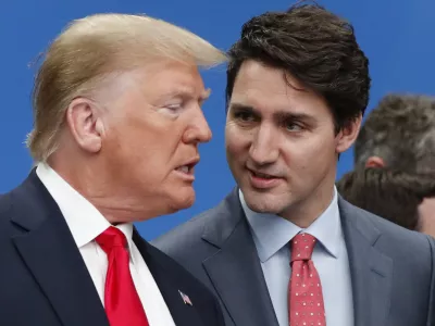 FILE - U.S. President Donald Trump, left, and Canadian Prime Minister Justin Trudeau talk prior to a NATO round table meeting at The Grove hotel and resort in Watford, Hertfordshire, England, Dec. 4, 2019. (AP Photo/Frank Augstein, File)