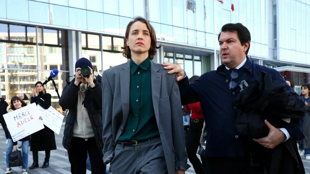 Adele Haenel leaves with her lawyer Yann Le Bras after the verdict in the trial of French film director Christophe Ruggia for sexually abusing her on set while she was an adolescent, at the criminal court in Paris, France, February 3, 2025. REUTERS/Abdul Saboor   TPX IMAGES OF THE DAY