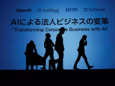 Venue staff arrange the stage for a talk session with SoftBank CEO Masayoshi Son and OpenAI CEO Sam Altman during an event to pitch AI for businesses in Tokyo, Japan February 3, 2025. REUTERS/Kim Kyung-Hoon   TPX IMAGES OF THE DAY