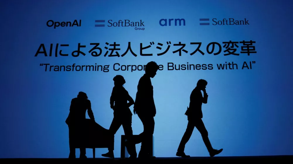 Venue staff arrange the stage for a talk session with SoftBank CEO Masayoshi Son and OpenAI CEO Sam Altman during an event to pitch AI for businesses in Tokyo, Japan February 3, 2025. REUTERS/Kim Kyung-Hoon   TPX IMAGES OF THE DAY