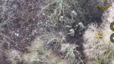 This image made from a video provided by Ukrainian Presidential Press Office on Jan. 11, 2025, shows Ukrainian forces capturing two North Korean soldiers fighting alongside Russian forces in Russia's Kursk border region. (Ukrainian Presidential Press Office via AP)